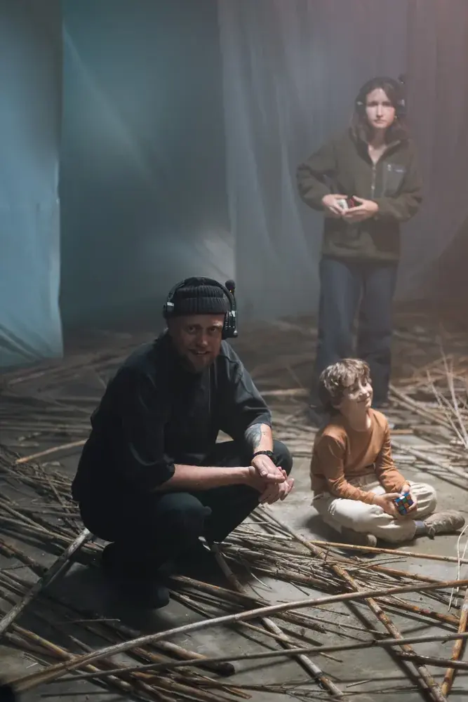 Director with the young actor on the branches set