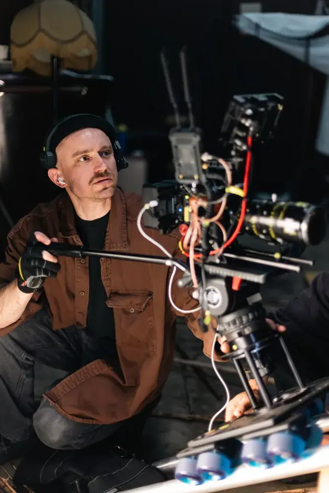 Camera operator with the rig close to the floor
