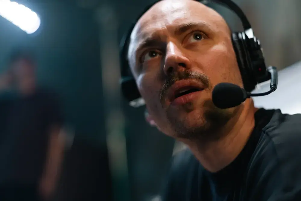Camera operator with headset following the action