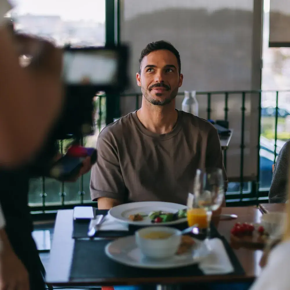 Actor at the restaurant table between takes