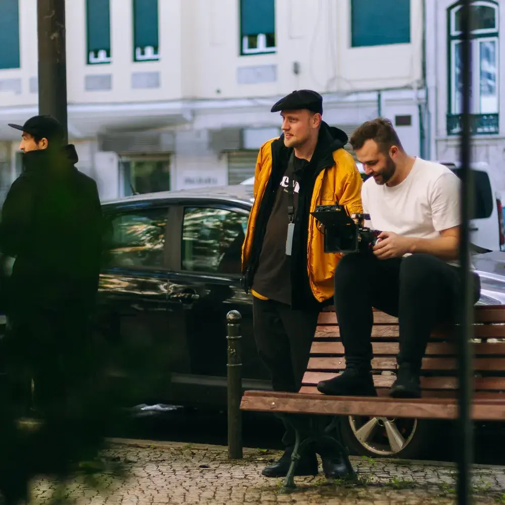Crew on a bench outside the location