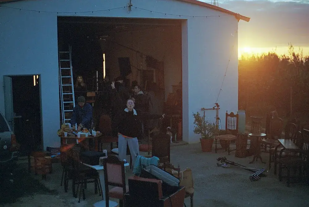 The crew outside the studio barn at sunset during the Lisbon Sessions shoot