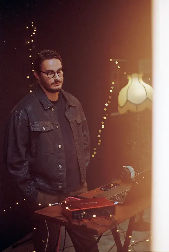 Musician at the laptop and audio interface during the session