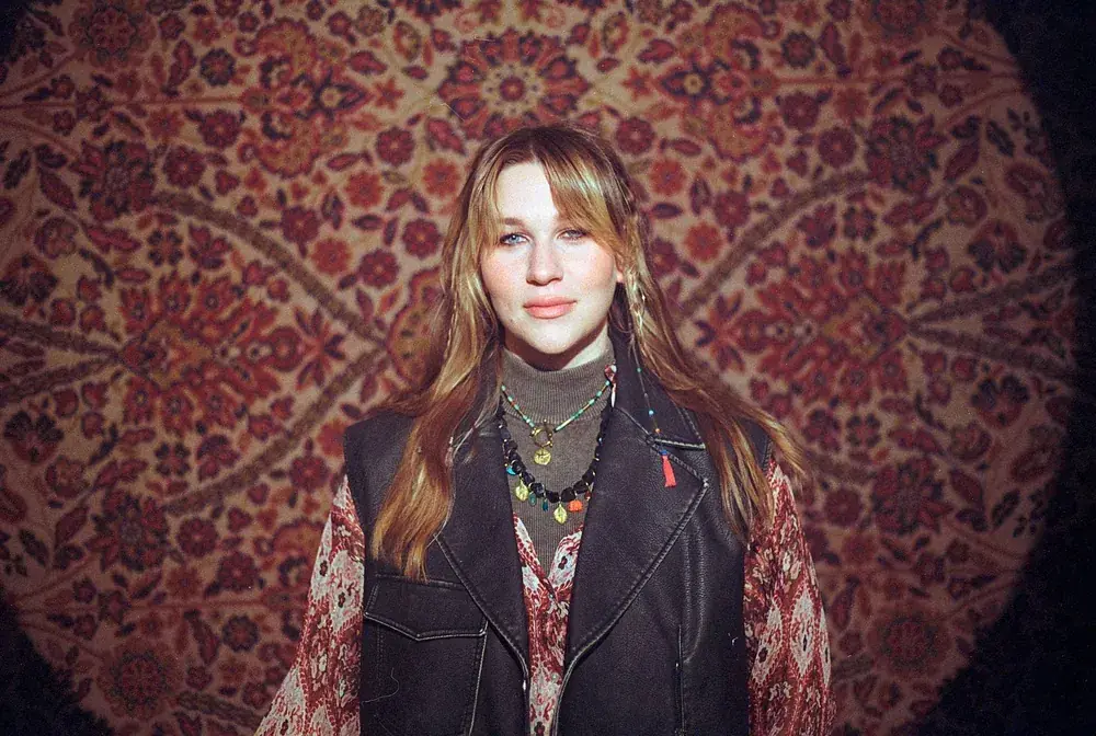 Portrait of Sonya Shats against the carpet backdrop