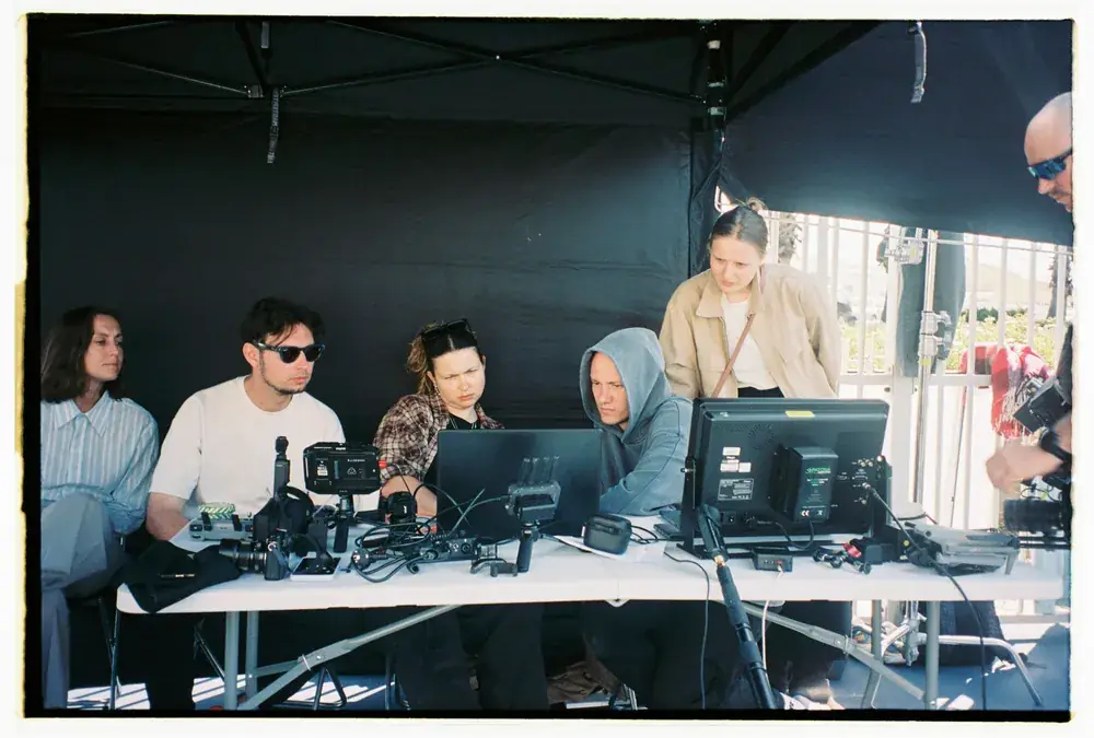 Video village under a tent: monitors and production team on location in Portugal