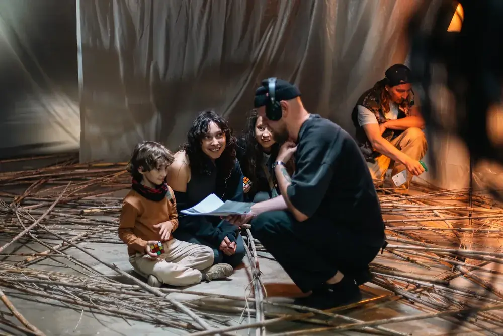 Director talking a scene through with the young actor on the APAV set