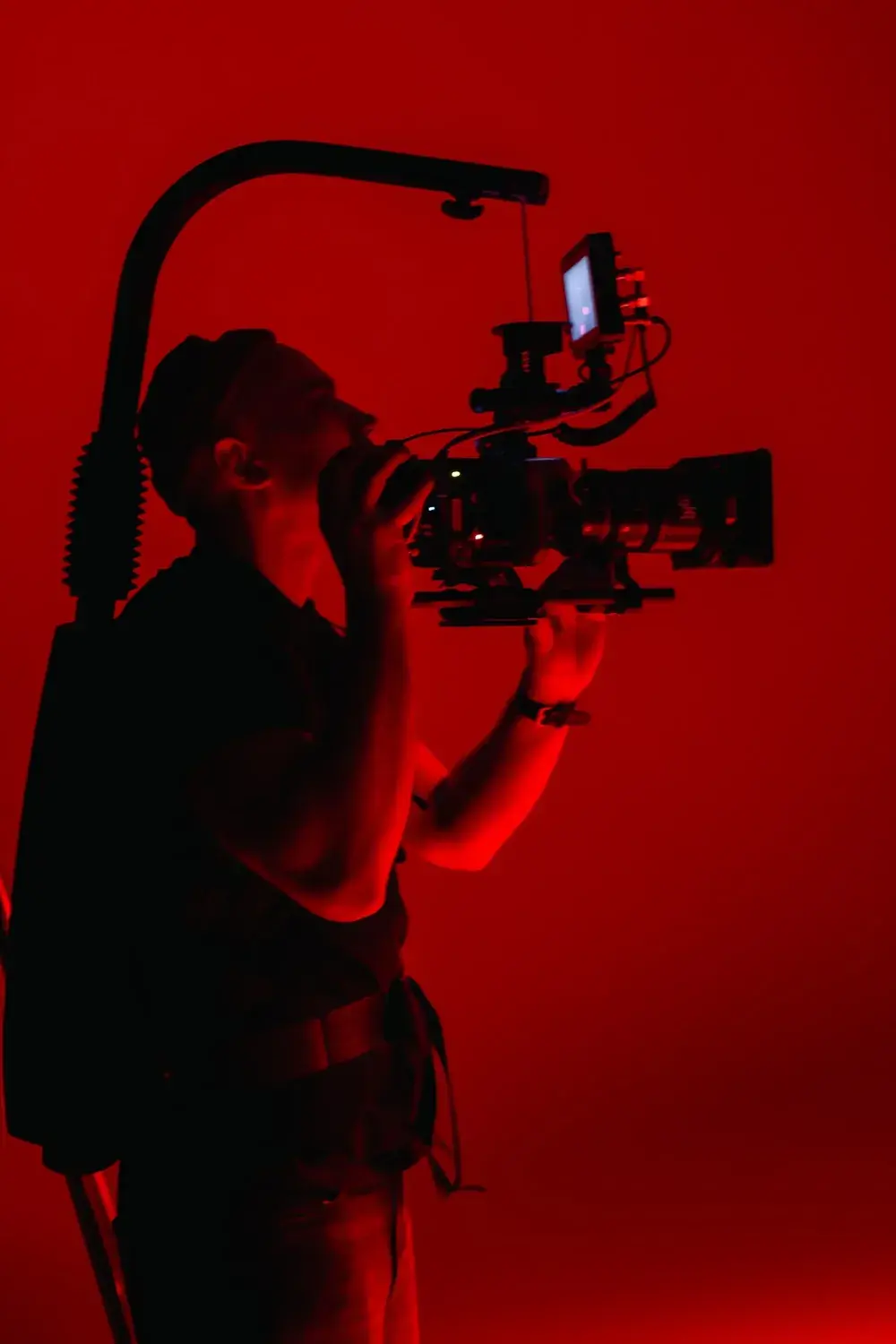 Camera on set under red light at Comuna Studios