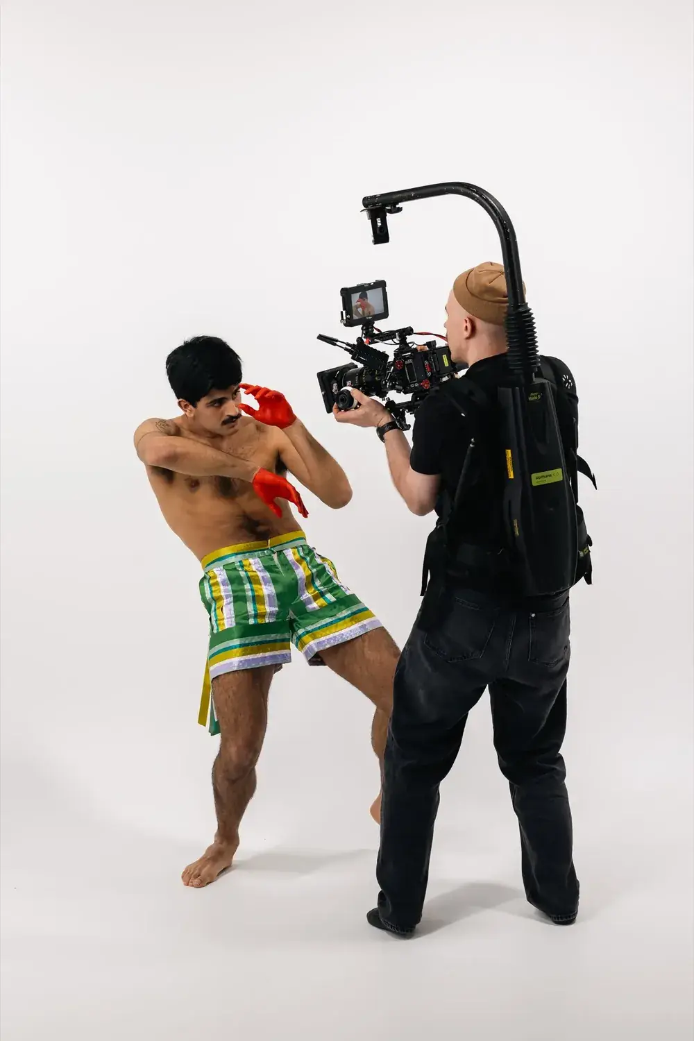 Camera and dancer face to face on set